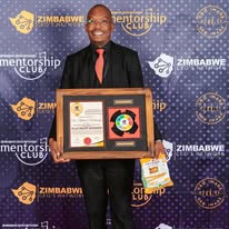 Dr Rushwaya receiving national recognition for contribution to education